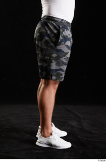 Grigory  1 camo shorts dressed flexing leg side view…